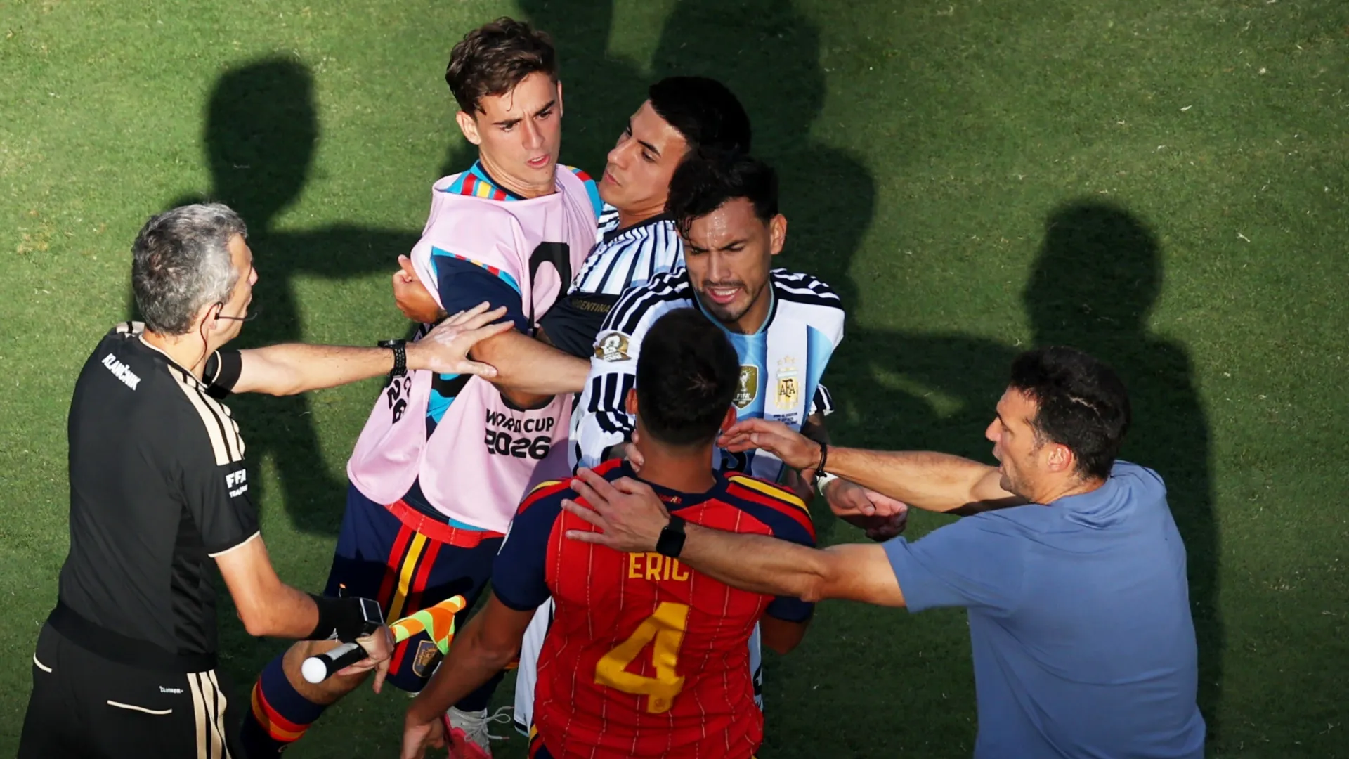 Leandro Paredes #5 of Argentina and Eric Garcia #4 of Spain fight on field.