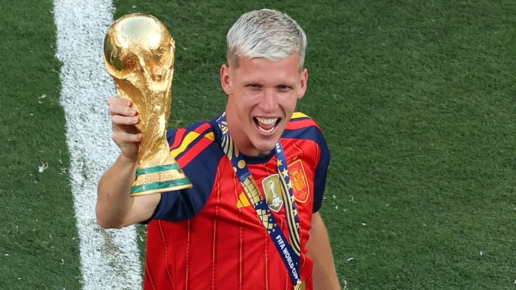 Dani Olmo #10 of Spain celebrates with the FIFA World Cup Winner’s Trophy.