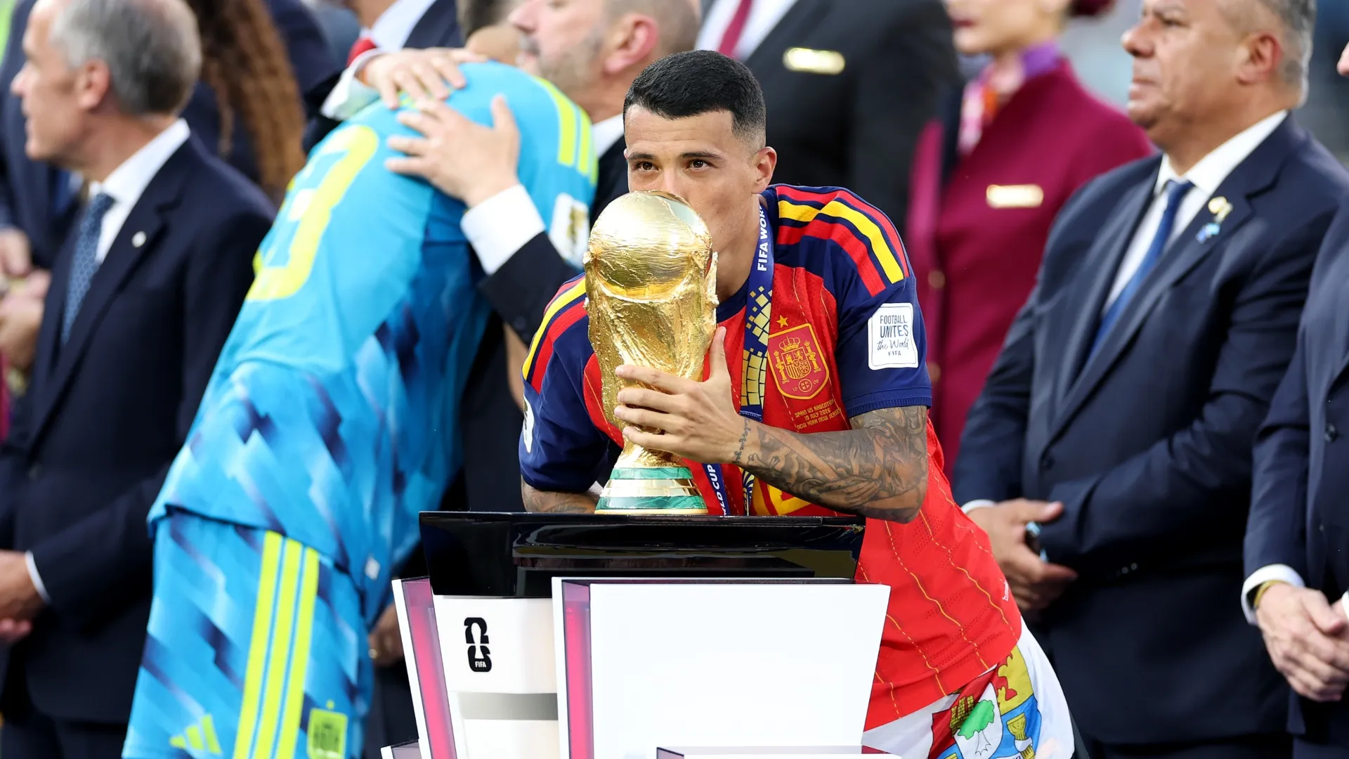 Pedro Porro #12 of Spain kisses the World Cup Winner's Trophy.