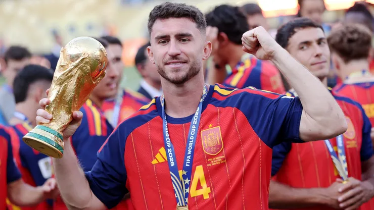 Aymeric Laporte #14 of Spain celebrates with the FIFA World Cup Winner’s Trophy.