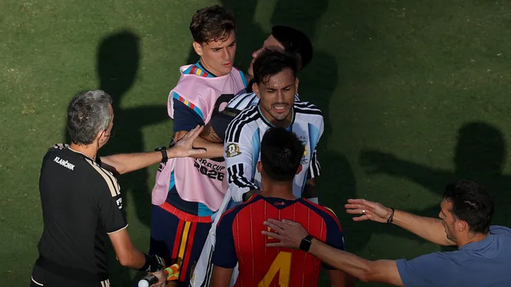 Leandro Paredes #5 of Argentina and Eric Garcia #4 of Spain