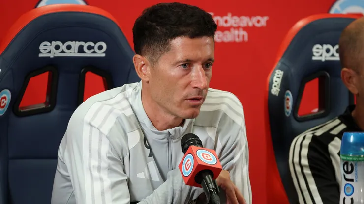 Robert Lewandowski #9 speaks to the media during a press conference.