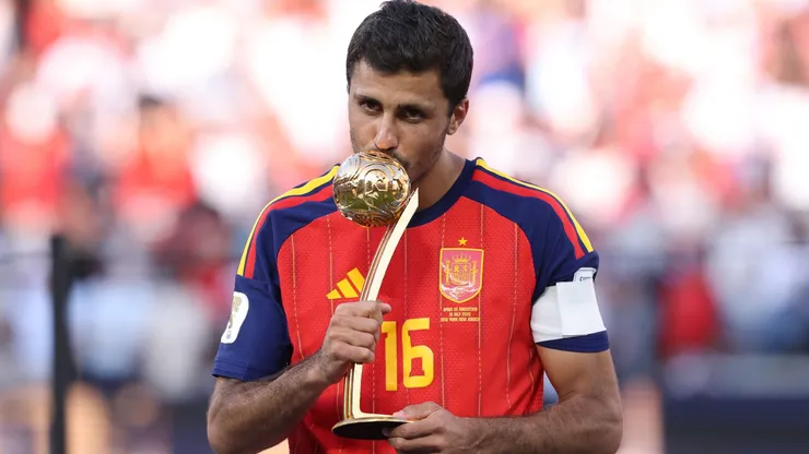 Rodri #16 of Spain is presented with the Golden Ball award.