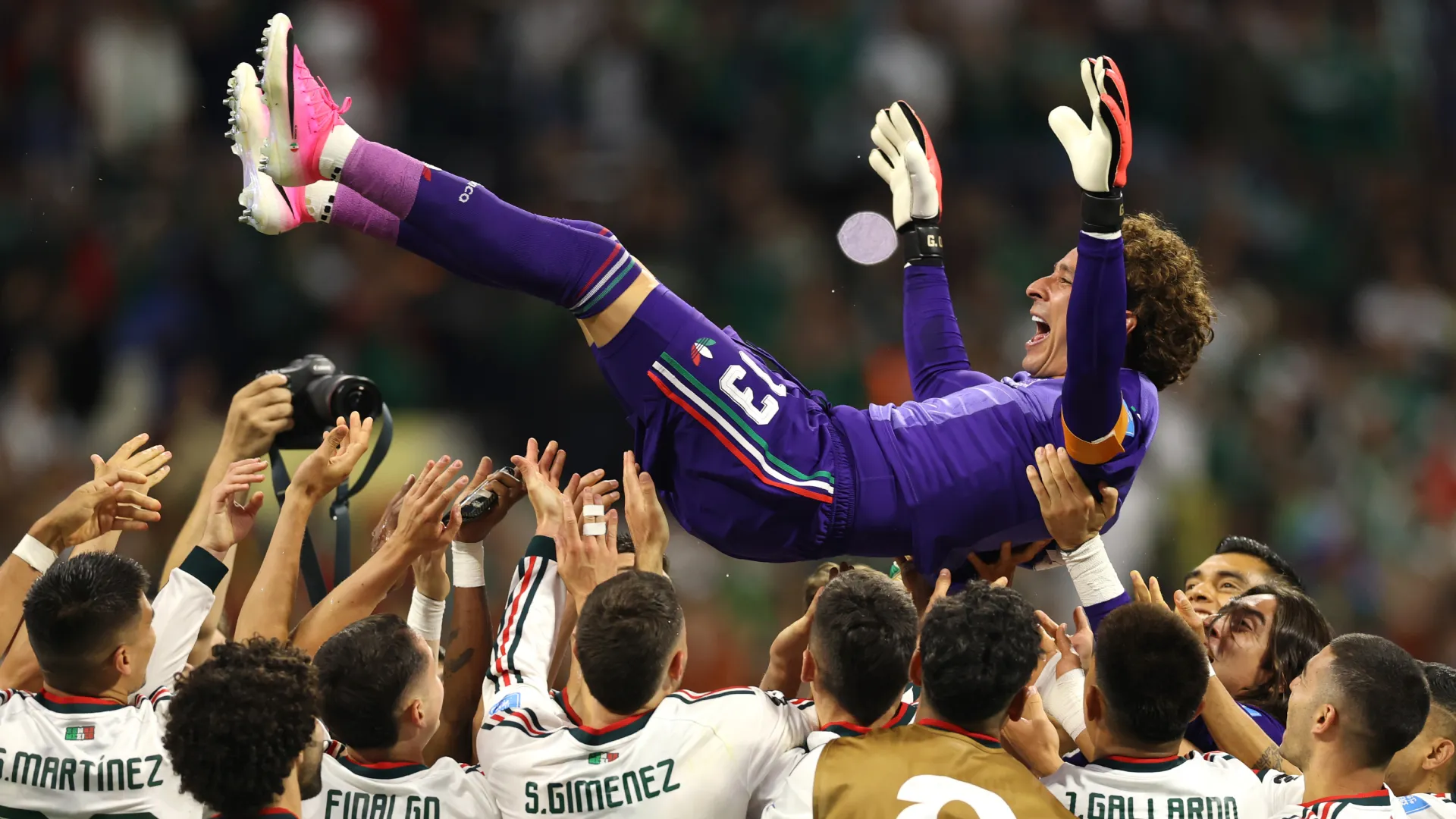 Guillermo Ochoa #13 of Mexico is tossed into the air by his teammates. (Getty Images)