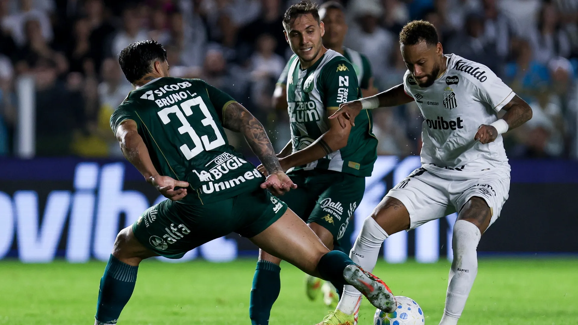 Neymar Junior of Santos competes for the ball with Bruno Leonardo of Chapecoense.