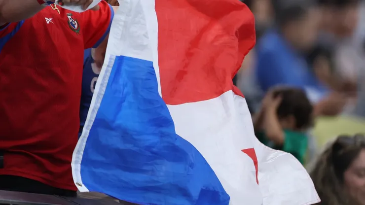 A fan waves the flag of Panama