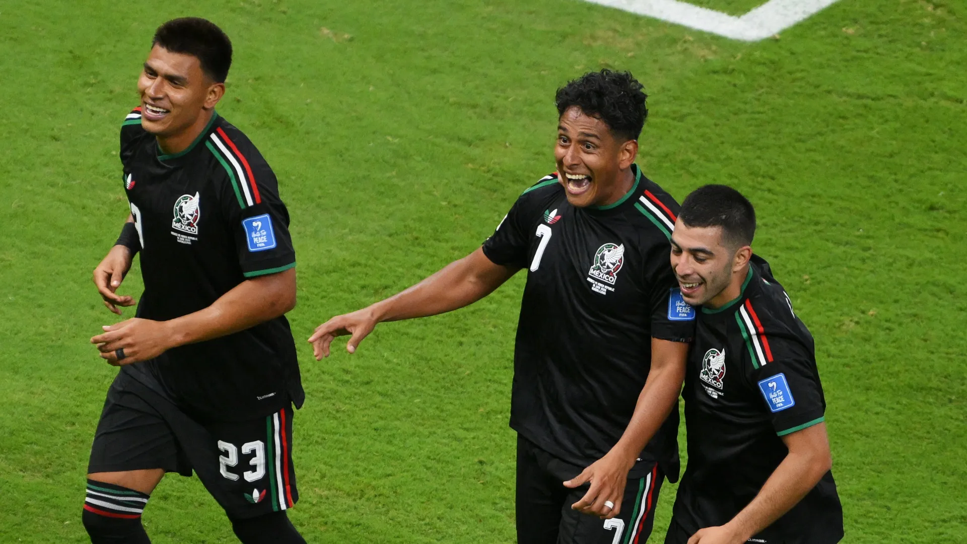 Luis Romo #7 of Mexico celebrates with teammates Jesus Gallardo #23 and Erik Lira #6 of Mexico.