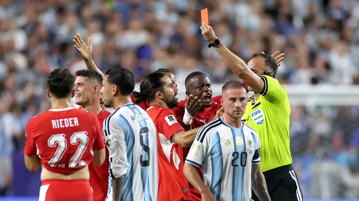 Referee Joao Pinheiro shows a red card to Breel Embolo #7 of Switzerland.