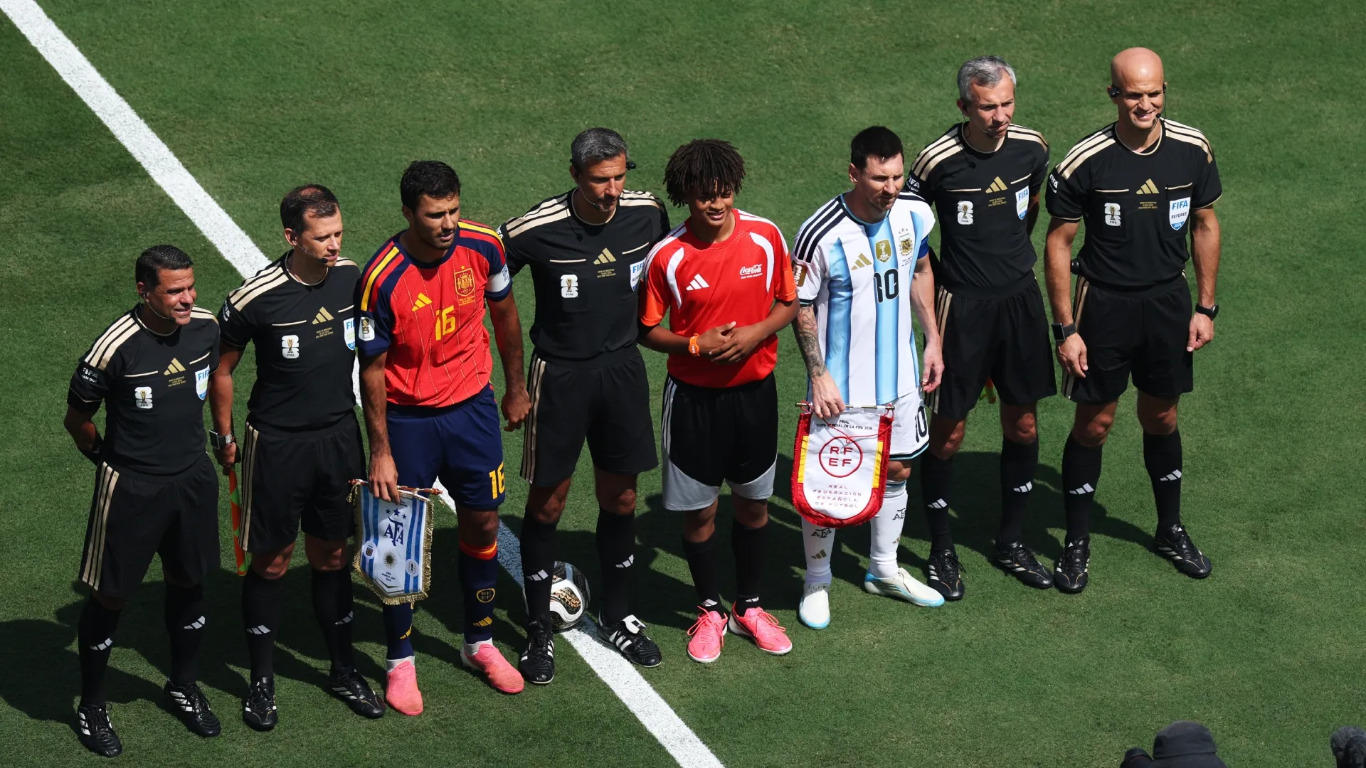 Captains Rodri of Spain and Lionel Messi of Argentina pose with Referee Slavko Vincic and match officials before World Cup 2026 Final. (Kevin C. Cox/Getty Images)