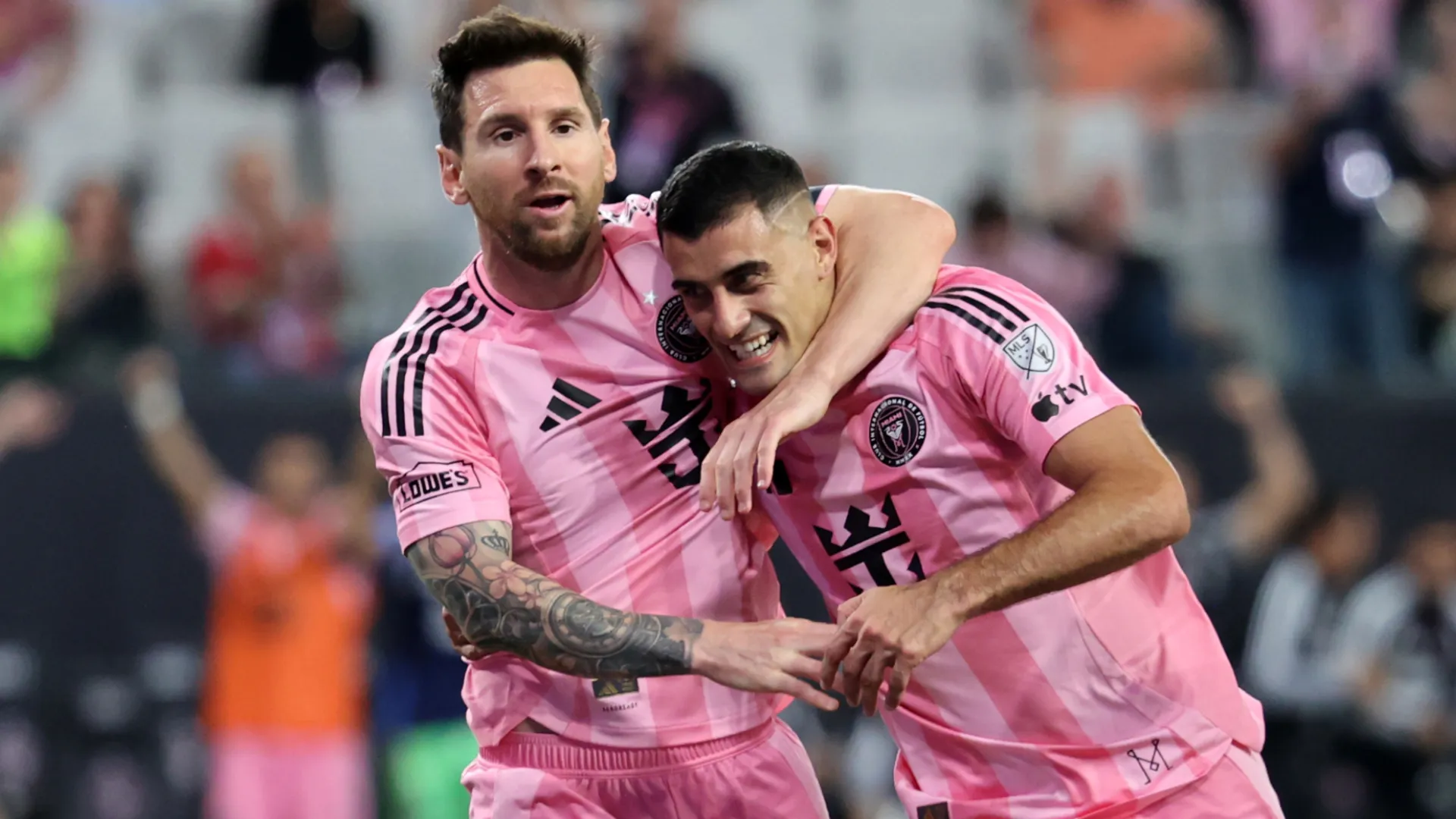 German Berterame celebrates a goal with Lionel Messi. (Getty Images)