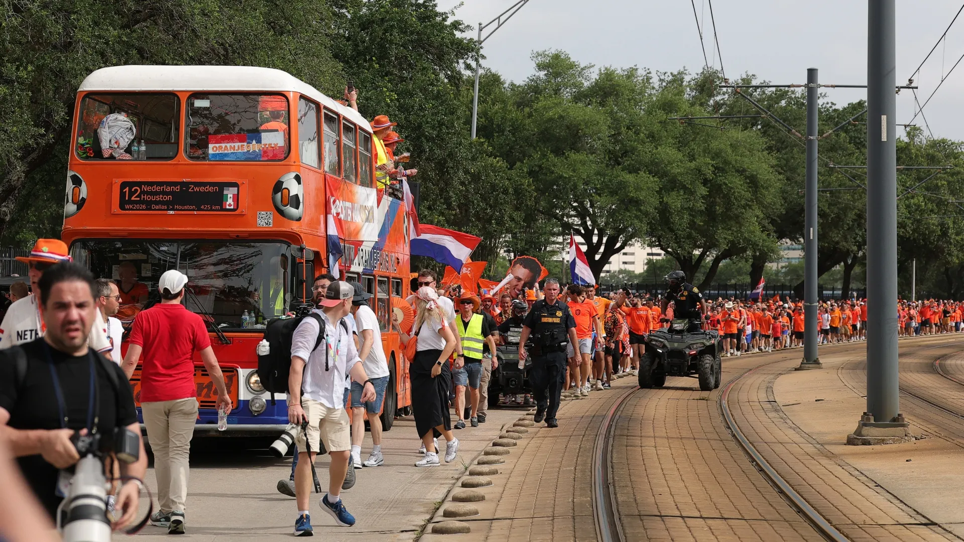Fans of the Netherlands make their way to the stadium.