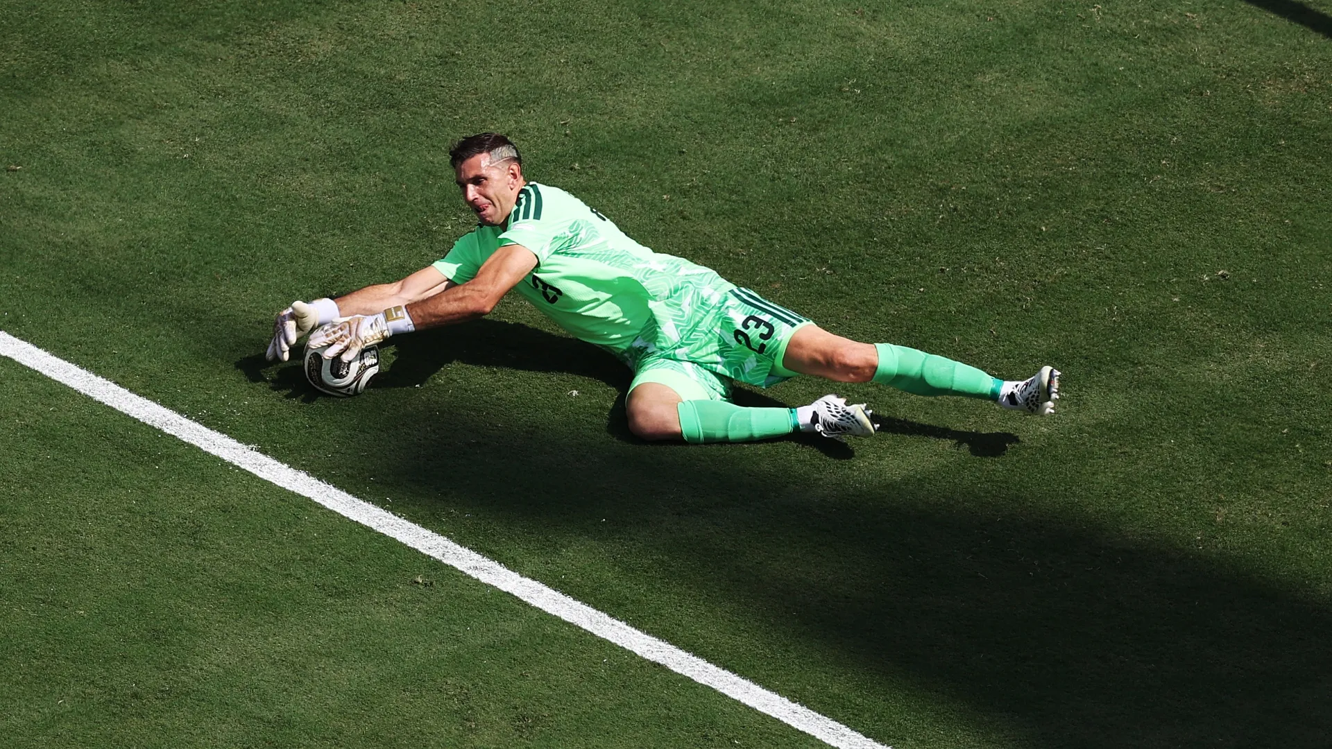 Emiliano Martínez #23 of Argentina makes a save during 2026 World Cup Final against Spain.