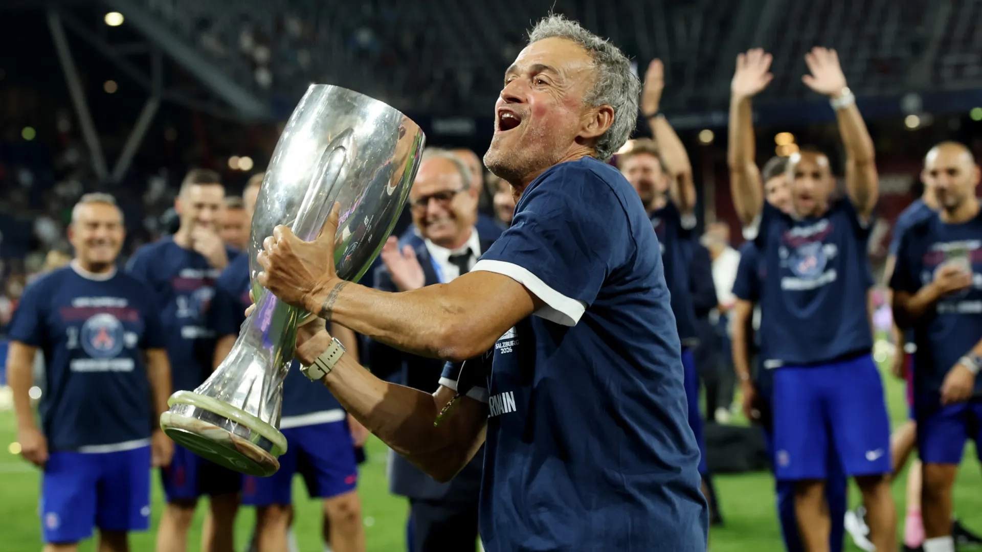 Luis Enrique celebrates as he lifts the UEFA Super Cup trophy. (Getty Images)