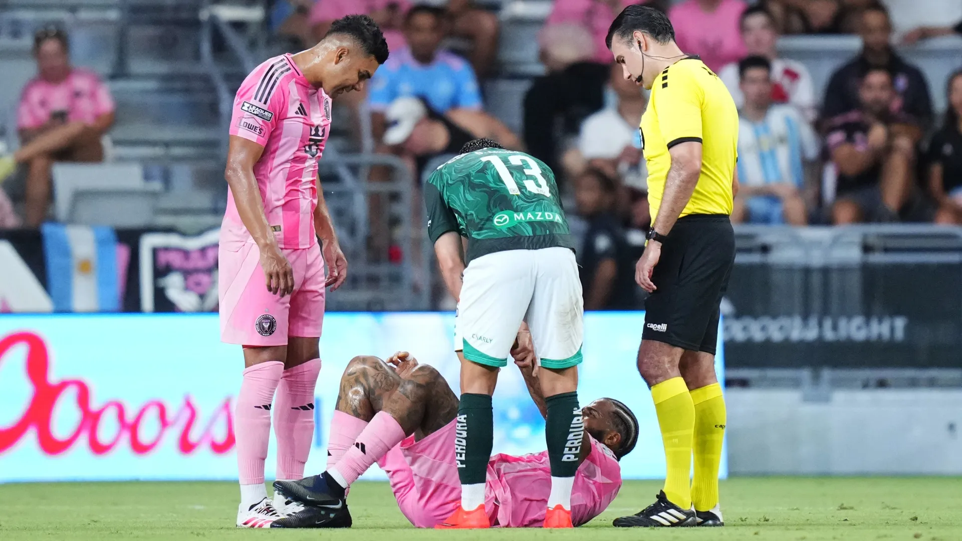 Micael #16 of Inter Miami CF reacts after suffering an injury against Club Leon.