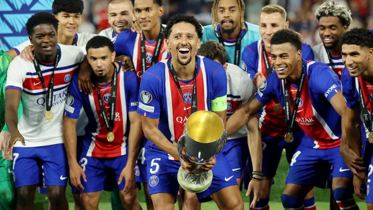 Marquinhos of Paris Saint-Germain prepares to lift the UEFA Super Cup trophy.