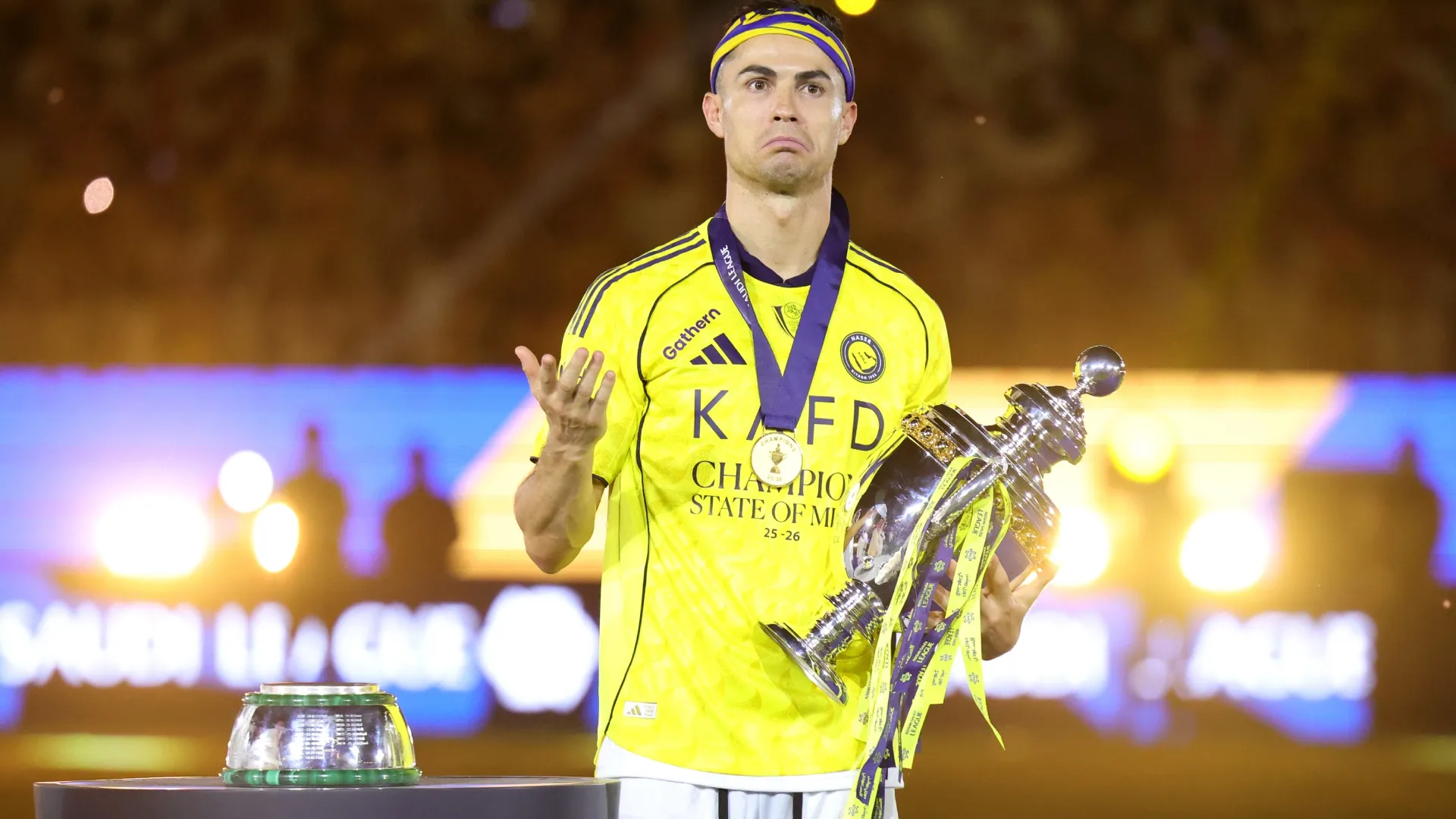 Cristiano Ronaldo of Al Nassr celebrates with the Saudi Pro League Trophy.