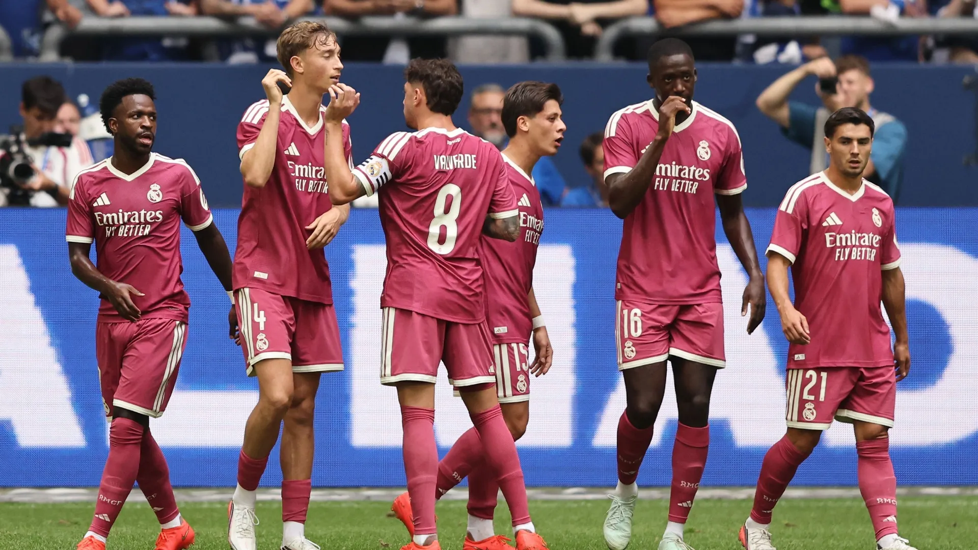 Dean Huijsen of Real Madrid (2nd L) celebrates the second goal against Schalke 04.