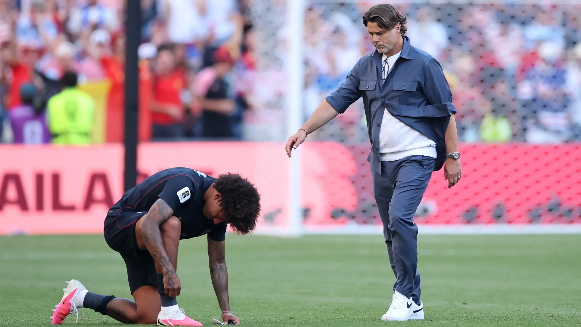Chris Richards is consoled by Mauricio Pochettino after 4-1 loss to Belgium. (Getty Images)