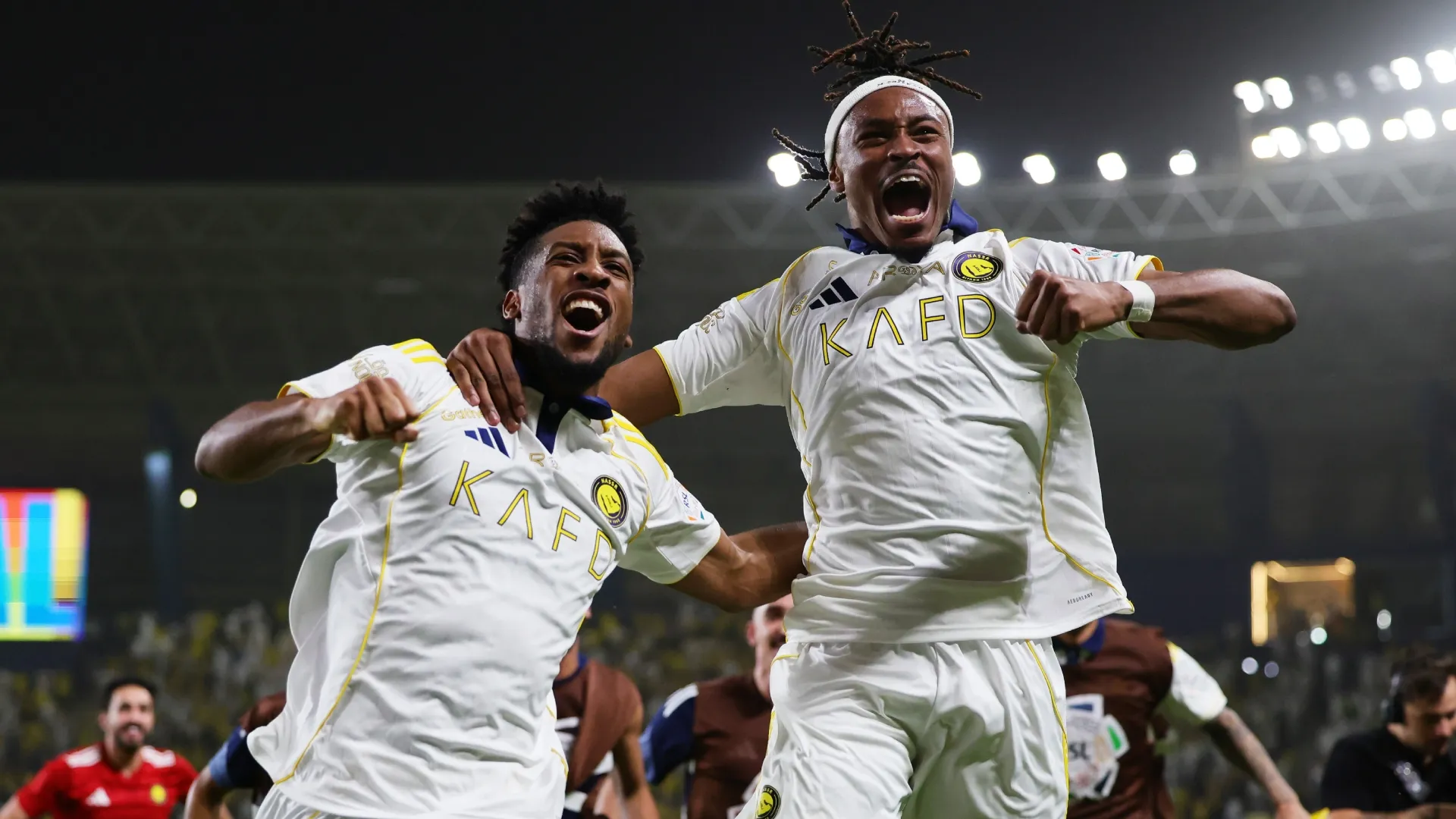 Kingsley Coman of Al Nassr celebrates alongside Mohamed Simakan.