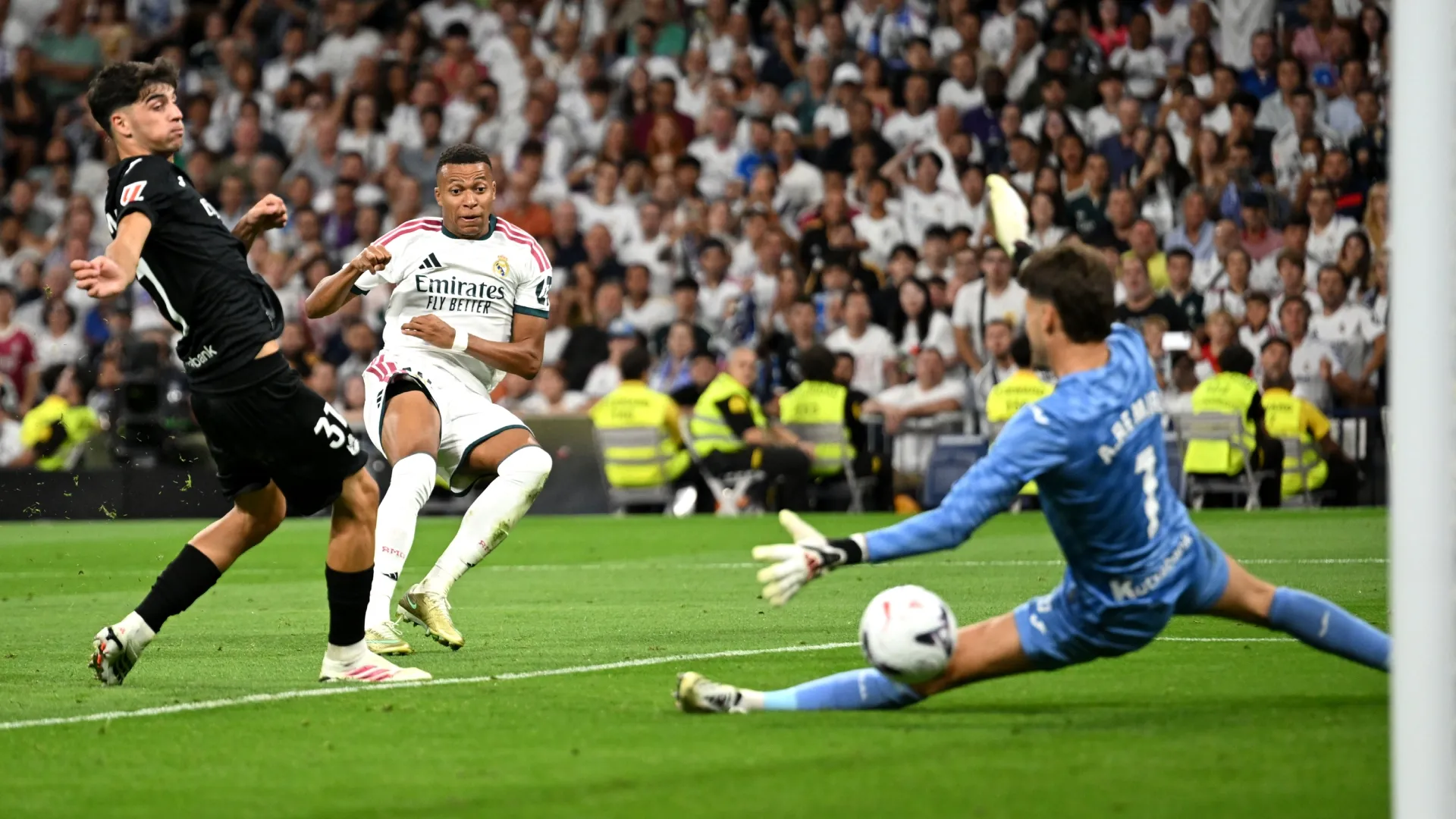Kylian Mbappe of Real Madrid scores against Real Sociedad.