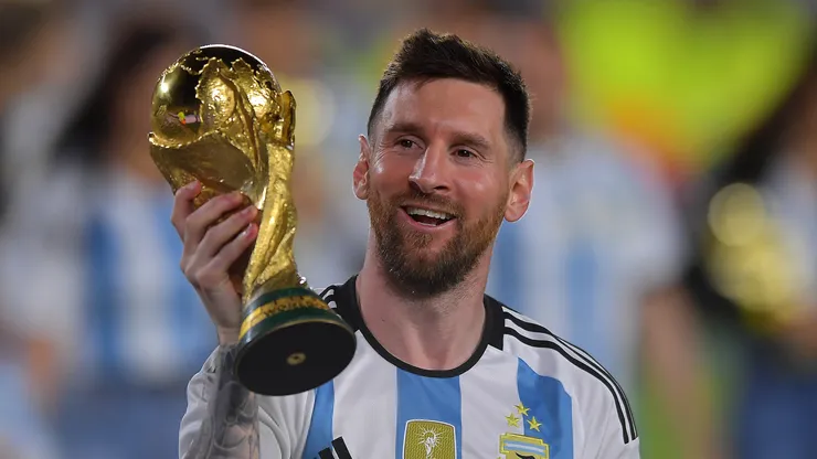 Lionel Messi holding the World Cup trophy