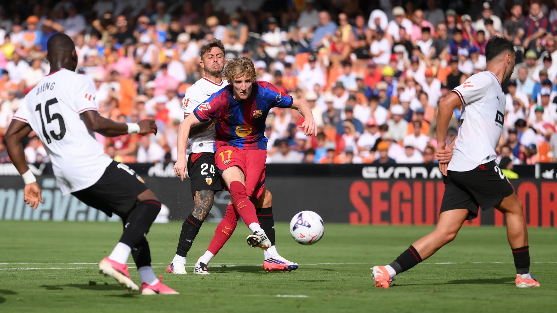 Anthony Gordon of Barcelona shoots against Valencia.