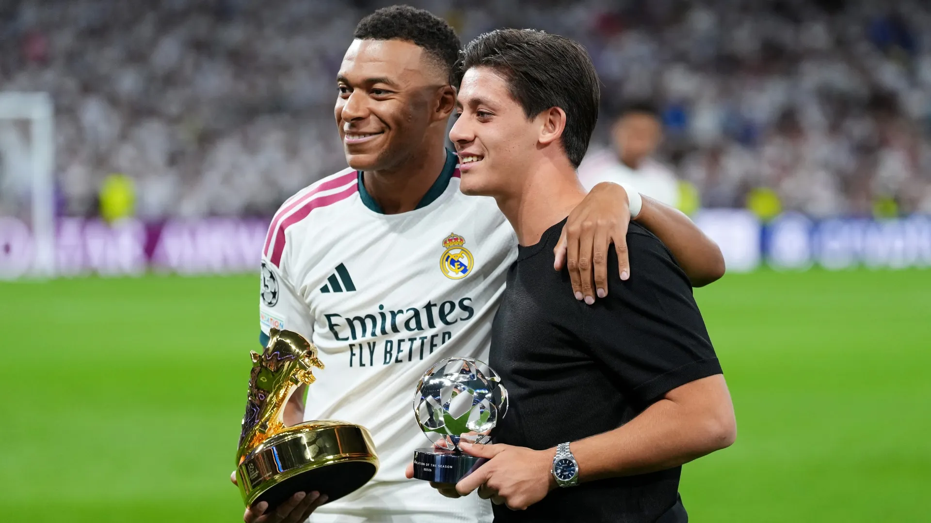 Kylian Mbappe and Arda Guler with the Golden Boot and Revelation award.
