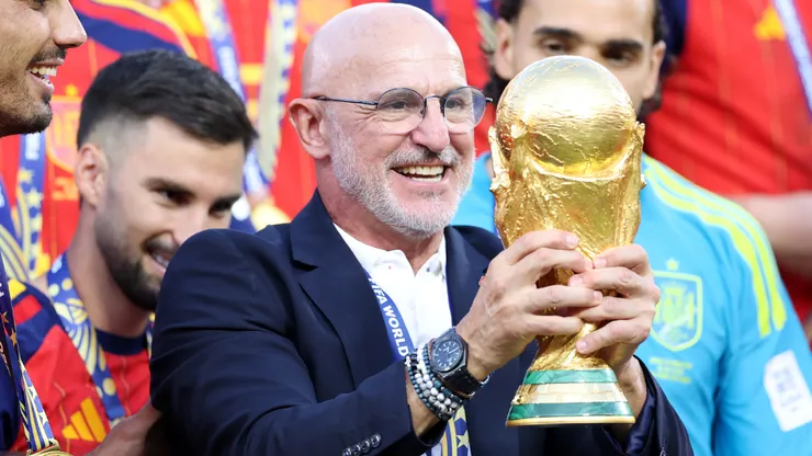 Luis de la Fuente, Head Coach of Spain, lifts the World Cup trophy.
