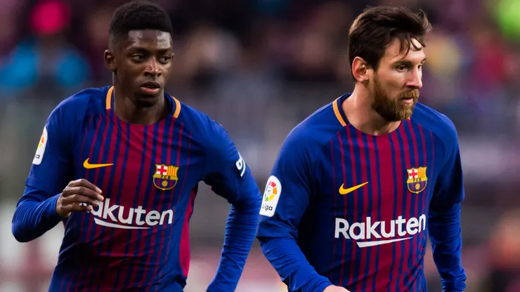 Lionel Messi of FC Barcelona conducts the ball next to his teammate Ousmane Dembele