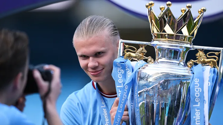 Erling Haaland of Manchester City celebrates with the Premier League trophy