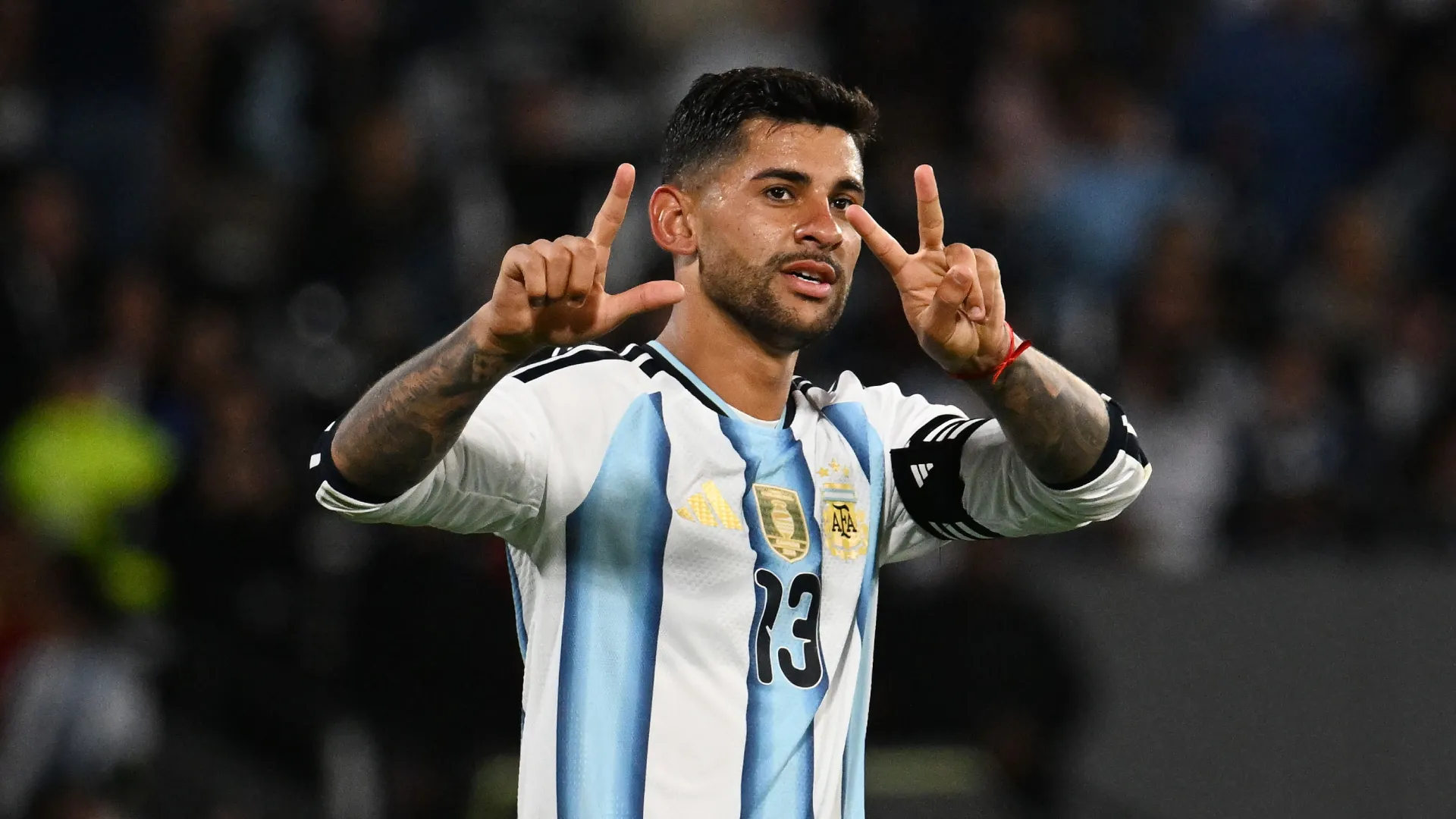 Cristian Romero celebrates after scoring against Bolivia, wearing the captain’s armband. (Getty Images)