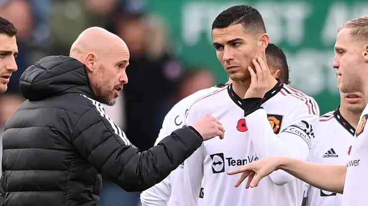 Cristiano Ronaldo of Manchester United listens as manager Erik ten Hag gives instructions