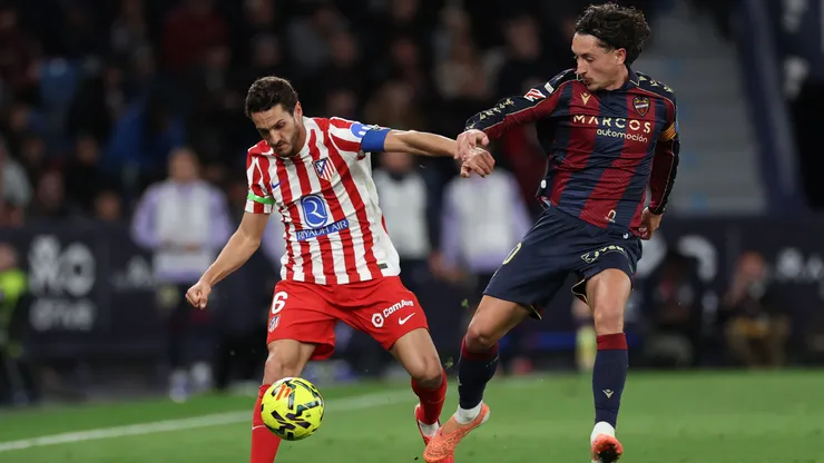 Koke of Atletico de Madrid battles for possession with Pablo Martinez of Levante UD.